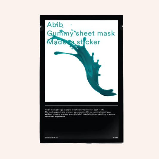 Abib Gummy Sheet Mask Madecassoside Sticker 27ml – weißes Maskensachet mit blau-grünem Spritzer vor dunklem Grund