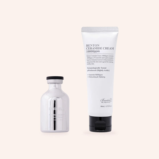 „Barrier Shield“ zur Wiederherstellung der Hautbarriere – silberne Serumflasche und weiße Ceramid-Creme in der Tube auf zartrosa Grund