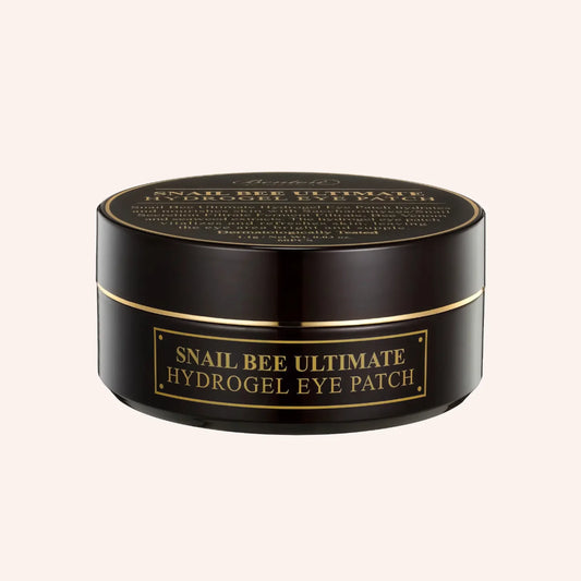 Benton Snail Bee Ultimate Hydrogel Eye Patch 60St. – dunkle Dose mit goldfarbenem Deckel vor schwarzem Hintergrund