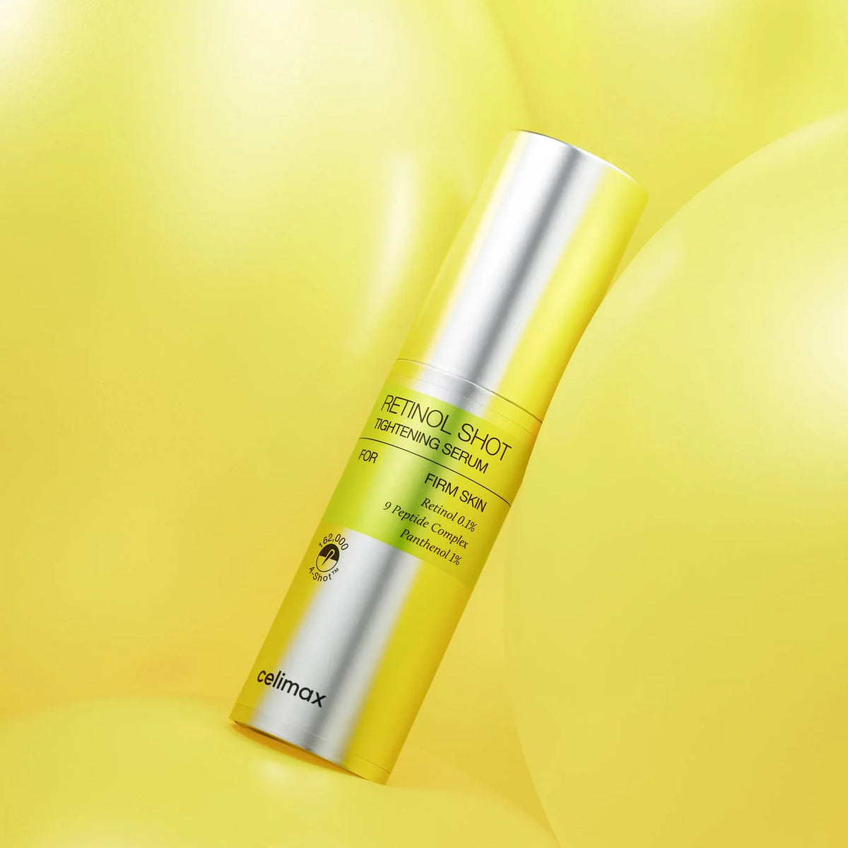 Celimax The Vita A Retinol Shot Tightening Serum 30 ml – zylindrischer Behälter schräg vor leuchtend gelben Ballons