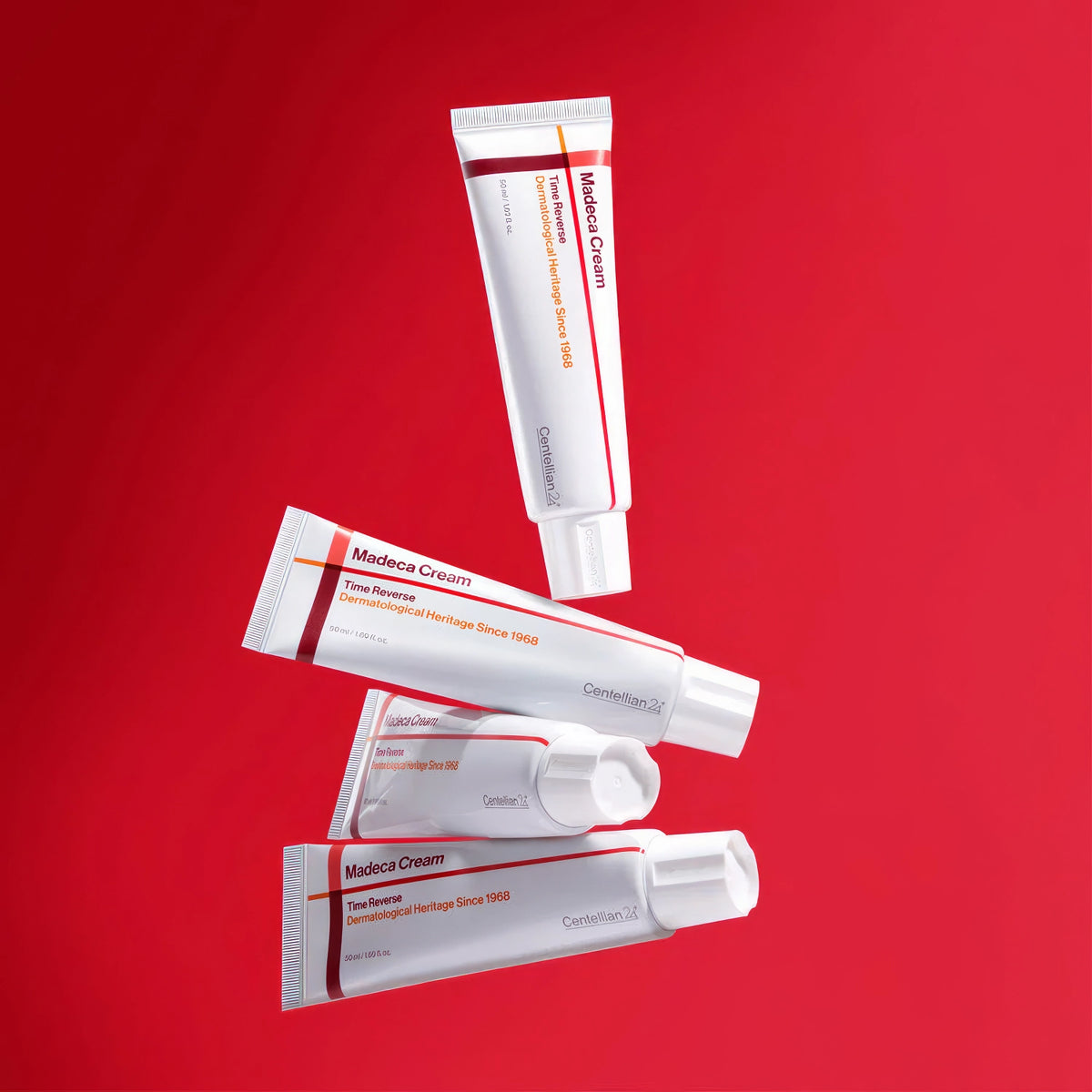 Centellian24 Madeca Cream Time Reverse 50ml – Tuben und Tiegel im Fächer auf Rot