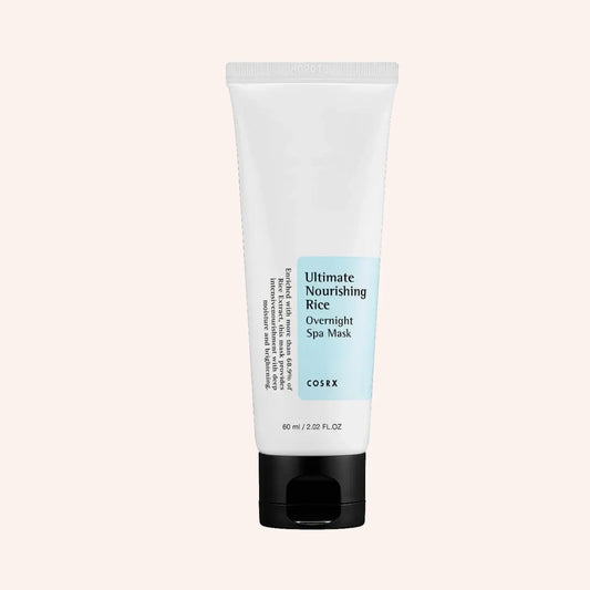COSRX Ultimate Nourishing Rice Overnight Spa Mask 60ml – Tube mit umlaufendem Etikett vor schwarzem Hintergrund