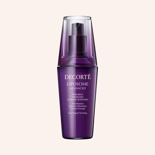 DECORTE Liposome Advanced Repair Serum 30ml – Flasche mit violettem Inhalt auf schwarzem Hintergrund