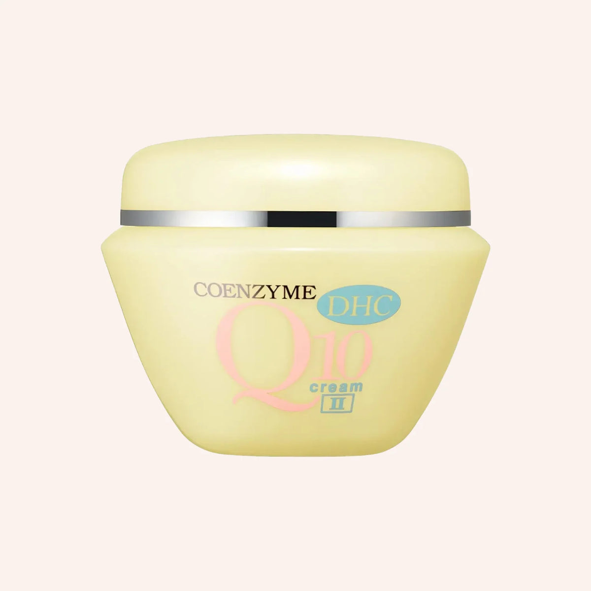 DHC Q10 Cream 20g – Gelbe Tube vor schwarzem Hintergrund mit großer Schrift auf dem Etikett, aufrecht stehend