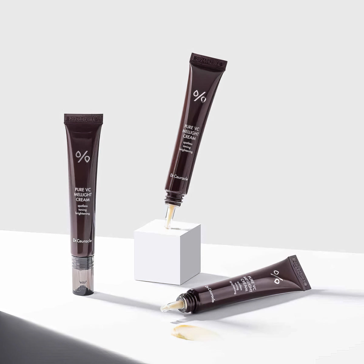 Dr. Ceuracle Pure VC Mellight Cream 20g – links eine aufrechte Tube mit Pumpkopf, rechts ein zweiter Behälter, auf Weiß