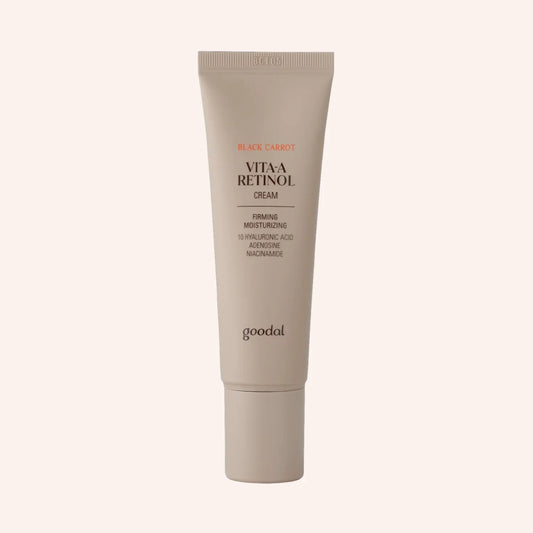 Goodal Black Carrot Vita-A Retinol Firming Cream 50ml – Tube in Weiß-Beige mit Farbverlauf vor dunklem Grund