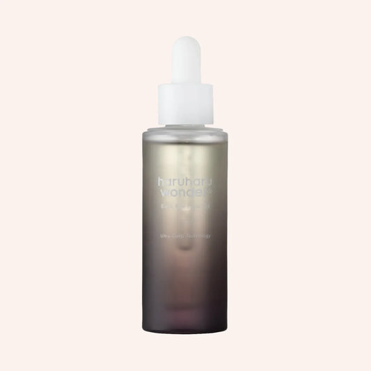 Haruharu Wonder Black Rice Facial Oil 30ml – rechteckige matte Flasche mit Pipette vor dunklem Hintergrund