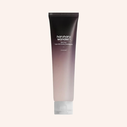 Haruharu Wonder Black Rice Triple AHA Gentle Cleansing Gel 100ml – Tube im Verlauf von Dunkel zu Blasslila vor dunklem Grund