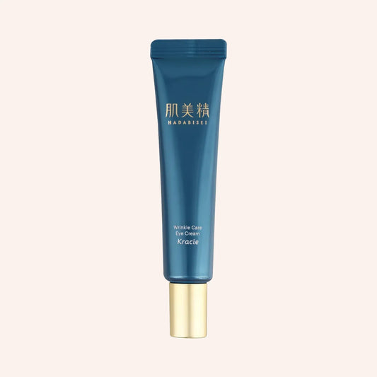 Kracie Hadabisei One Wrinkle Care Eye Cream 15g – blaue Tube mit Verlauf von dunkel nach hell vor Schwarz