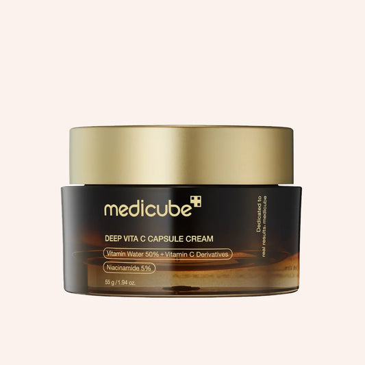 Medicube Deep Vita C Capsule Cream 55g – Tiegel mit Umkarton vor schwarzem Hintergrund
