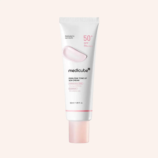 Medicube PDRN Pink Tone Up Sun Cream 50ml – weiße Tube mit rosa Kappe auf Rosa