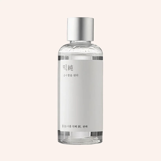 Mixsoon Hinoki Essence 100ml – klare Glasflasche mit Metallkappe und weißem Etikett vor schwarzem Hintergrund