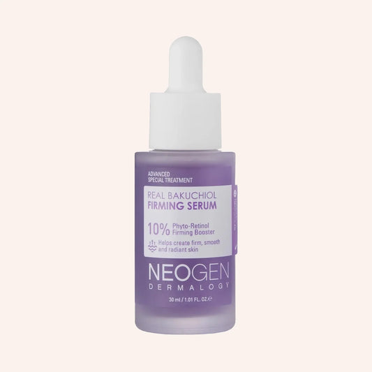 Neogen Dermalogy Real Bakuchiol Firming Serum 30ml – Pipettenflasche mit lilafarbener Kappe vor einfarbig dunklem Hintergrund