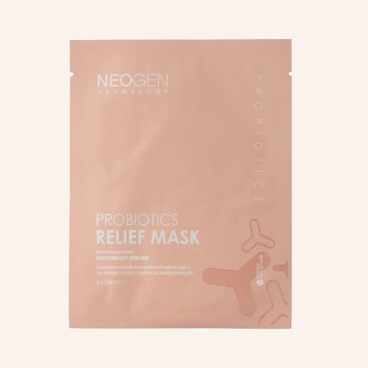 Neogen Probiotic Relief Mask 1pc/25g – rosafarbenes Sachet mit orange-weißer Schrift und kleinem Fenster vor hellrosa Grund