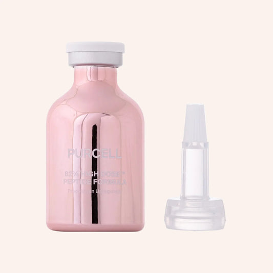 Purcell 82% High Dose Peptide Formula 30ml – rosa Pipettenflasche neben Umkarton und Zubehör