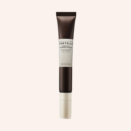 SKIN1004 Madagascar Centella Probio-Cica Bakuchiol Eye Cream 20ml – dunkel getönte Tube vor schwarzem Hintergrund